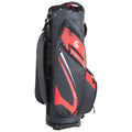 A golf bag stands upright showcasing a sleek design featuring a combination of black and red colors with multiple zippered pockets for storage placed on a flat surface