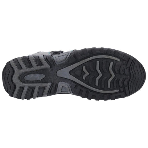 A black shoe sole is displayed upside down showcasing its textured pattern and tread grooves designed for traction and stability on various surfaces, typically for outdoor or athletic activities.