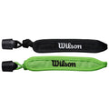 Two wristbands are displayed side by side with one in black featuring white "Wilson" text and the other in green with black "Wilson" text both designed for sports use.