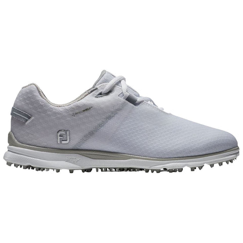 A grey golf shoe designed for performance sits alone emphasizing its sleek shape and textured surface with a unique sole featuring spikes for traction on the course.