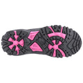 A black shoe sole with rugged tread features bold pink accents. It rests flat against a plain background, suggesting readiness for outdoor activities or sports.