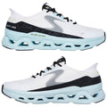 A pair of athletic shoes is displayed with a white upper featuring gray and black accents and a thick blue sole designed for comfort and support arranged side by side.