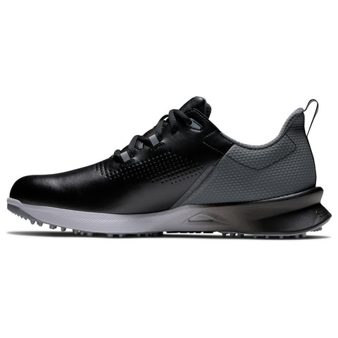 A black and gray athletic shoe is displayed sideways showcasing its sleek design it features a textured upper and a traction sole suitable for active use.