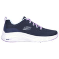 A navy blue athletic shoe with a white and light purple sole is shown standing on a flat surface featuring a breathable mesh upper and laces for secure fitting