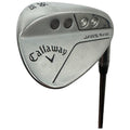 A Callaway golf wedge is positioned upright displaying its sleek metal finish and engraved details including "Jaws Raw" and "56" indicating the club's loft suitable for short-game precision near the putting green.