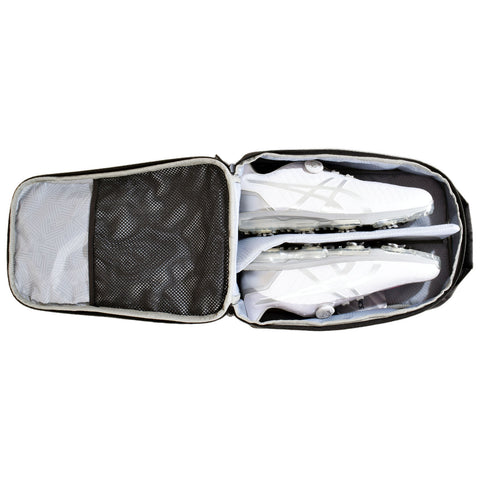 A zipped gray and white sports bag contains two pairs of white soccer cleats arranged neatly inside. A mesh pocket is visible on one side for additional storage.