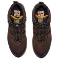 Brown hiking shoes are positioned on a flat surface with intricate lacing and padding designed for comfort and support suitable for outdoor activities Timberland branding is visible inside the shoes.