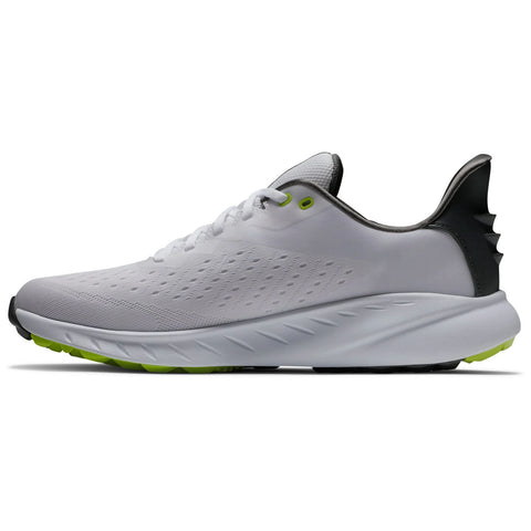 A white athletic shoe with a textured upper and a green outsole sits on a flat surface showcasing its streamlined design and contrasting black heel accent for added support.