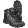 Black hiking boots are displayed upright with laces threaded through metal eyelets featuring rugged soles for traction showcasing a durable design suitable for outdoor activities