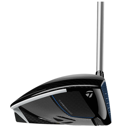 A golf driver is positioned with its clubhead facing forward showcasing a sleek black carbon fiber design featuring blue accents near the grip and the word "CARBONWOOD" visible on the surface.