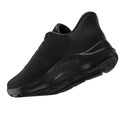 A black athletic shoe is shown at an angle showcasing its sleek design and textured surface indicating comfort and support in an active setting.