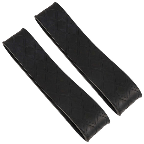 Two elongated black rubber strips with a diamond pattern lying flat on a neutral background serve as flexible tools often used in various applications such as securing objects or providing grip.