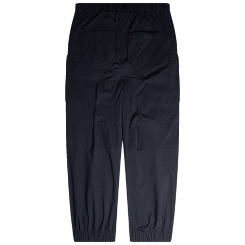 Black cargo pants with an elastic waistband and fitted cuffs rest flat. The design features multiple pockets, suitable for casual or work environments.