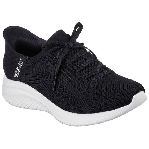 A black athletic shoe featuring a textured mesh upper with a white sole is displayed at an angle with laces tied neatly showcasing a sleek design suitable for casual wear or exercise.