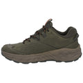 A green athletic shoe is positioned sideways with laces threaded through eyelets the shoe has a rugged sole and textured upper designed for outdoor activities and stability