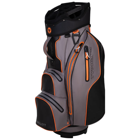 A gray and black golf bag with orange accents stands upright featuring multiple zippered pockets and a club compartment at the top designed for transporting golf clubs and accessories.