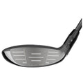 A golf club head with a sleek black design features a unique face pattern indicating advanced technology the club is likely intended for improved performance in golf games