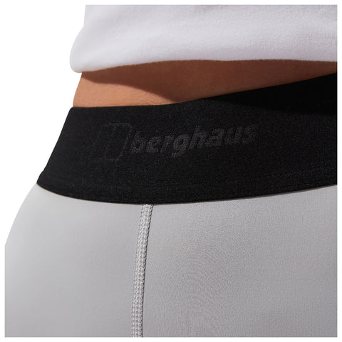 A pair of fitted athletic leggings is shown with a black waistband featuring the brand name on the front the context suggests activewear likely for exercise or outdoor activities.