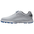 A white golf shoe features a sleek design with a fitted upper and blue spikes on the outsole designed for traction on the golf course. The background is plain.