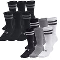 A collection of athletic socks displays various colors including black gray and white with different striped designs stacked together showing their fabric texture and brand logo prominently.