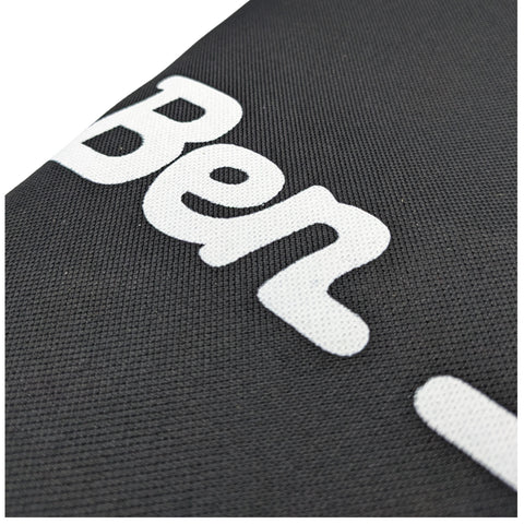 Black fabric features large white text that reads Ben The texture appears woven and slightly raised indicating a textile material used for branding or identification purposes