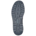 A black rubber shoe sole with a patterned tread is displayed facing upward showcasing grooves and grips designed for traction in various environments.