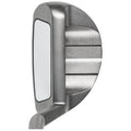 A golf club head is shown from the side featuring a shiny metal body and a flat striking surface with grooves highlighting its design for precision in striking a golf ball.