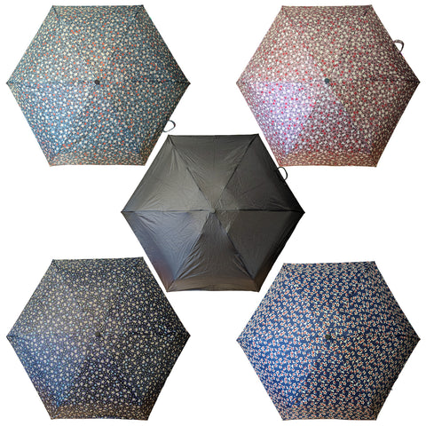 Five umbrellas are displayed in a circular arrangement. Each umbrella features different floral patterns and colors. They appear open and are situated against a neutral background.