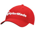 A red baseball cap features a white embroidered logo reading "TaylorMade" across the front with a rounded crown and a curved visor, designed for sporty or casual wear.