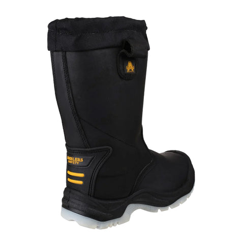 A black waterproof boot stands upright showcasing a reinforced toe and a textured rubber sole with safety features highlighting its design. It features a black fabric cuff and yellow branding.