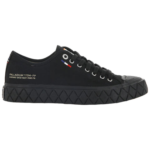 A black canvas sneaker features a rubber sole with a diamond pattern its eyelets are silver and there are minimalist accents in red white and blue on the side