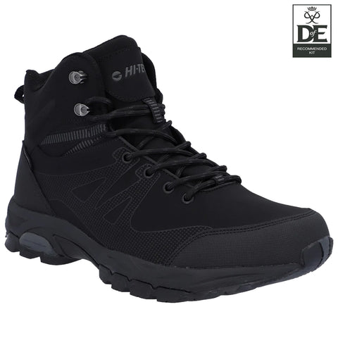 Black hiking boot with a textured surface features laces and metal eyelets designed for outdoor activities positioned against a plain white background with a logo in the corner indicating recommended kit.