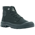 A black high-top boot is positioned upright showcasing its lace-up design and rubber sole with a rugged tread pattern the boot features a circular logo on the side.