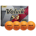 Four orange golf balls labeled Volvik 1 are arranged in front of a box marked Volvik S3 emphasizing its three-piece construction and soft feel in a promotional context.