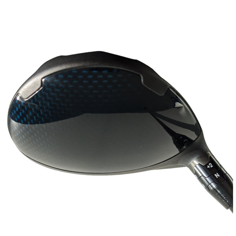 A golf club's head is prominently displayed featuring a sleek black finish with a blue patterned surface and adjustable settings on the side indicating customization options for performance.