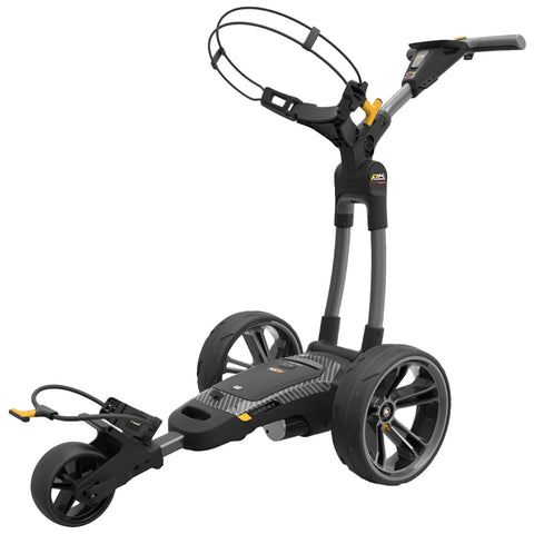 A golf trolley with a sleek design features large wheels and a raised handle. It is designed for transporting golf clubs and gear, suited for use on a golf course.