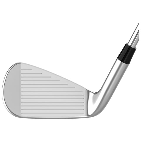 A golf club head with a shiny metallic finish is positioned horizontally showcasing its grooved face designed for striking a golf ball in an outdoor sports context.