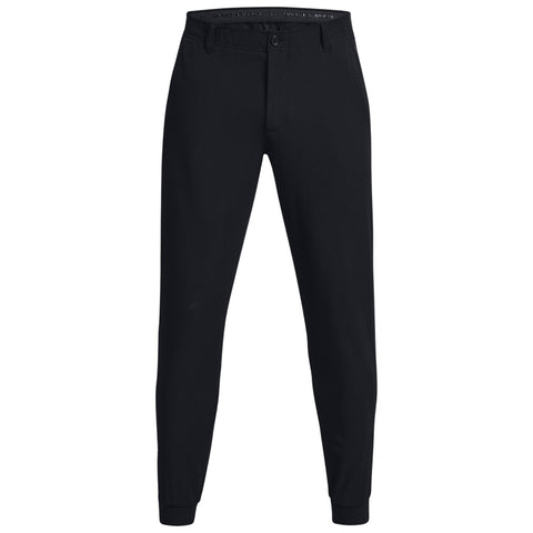 Black athletic pants are displayed standing upright showcasing a smooth texture and tapered, elastic cuffs against a plain background emphasizing their minimalist design