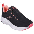 A black athletic shoe with a textured surface features pink accents and laces the shoe is positioned upright against a plain background showcasing its design and branding