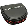 A black leather headcover with the text TRI-HOT in silver and ODYSSEY in red sits on a flat surface showcasing its smooth texture and sleek design.