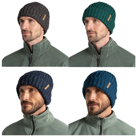 A man wears four different knit hats, each in varying colors, while sporting a zippered fleece jacket. He is positioned against a neutral background, showcasing the hats' designs.