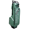 A green golf bag stands upright featuring multiple pockets and a logo. It accommodates golf clubs and gear while its waterproof design suggests it is suited for rainy conditions.