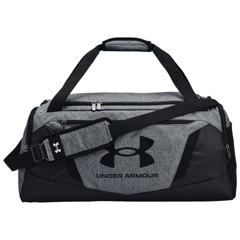 A gray and black duffel bag features dual handles and a shoulder strap with an adjustable buckle it has zippers and displays the Under Armour logo prominently on the side