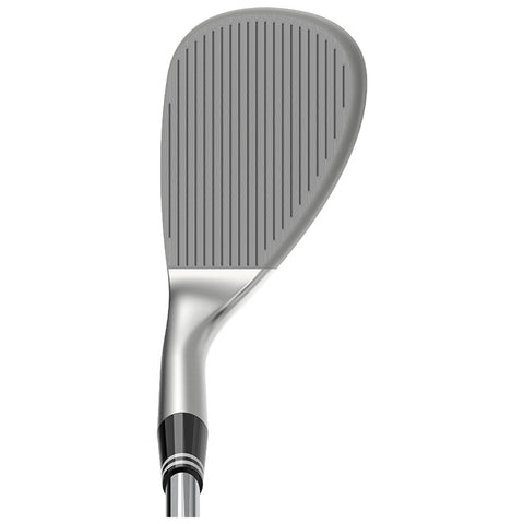 A golf club face with grooves is positioned upright showcasing its flat striking surface and shiny metallic finish highlighting details of its design and craftsmanship in an indoor setting