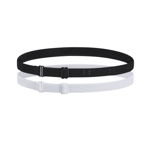 Two elastic headbands in black and white are overlapping on a white background showcasing their adjustable clasps and branding from Under Armour