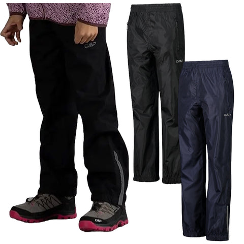 Black waterproof pants are worn by a person who is standing. Two other pairs of similar pants in black and navy are displayed alongside. The setting appears to focus on outdoor clothing.