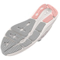 A sneaker sole features a detailed tread design with both gray and pink rubber elements showcasing grooves and patterns intended for traction on various surfaces in an athletic context.