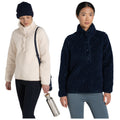 Two women stand side by side wearing cozy, stylish outerwear. The woman on the left wears a light-colored pullover and holds a water bottle, while the woman on the right dons a dark pullover.