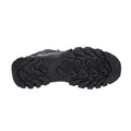 A black shoe sole with a rugged tread pattern is shown resting on a flat surface designed for traction on rough terrain ideal for outdoor activities.