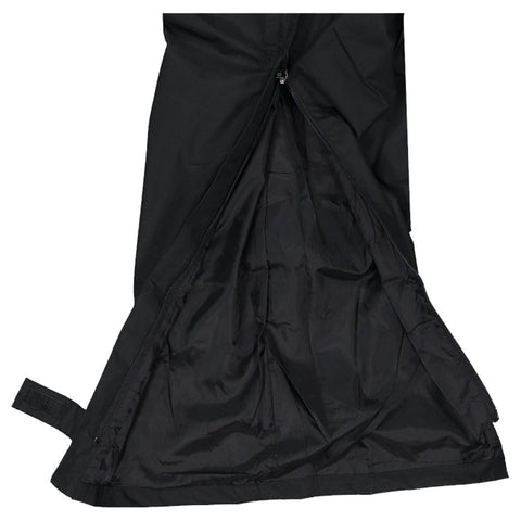 A black jacket is unzipped revealing its inner lining and structure while resting flat on a surface in a neutral environment without any additional objects or patterns visible.